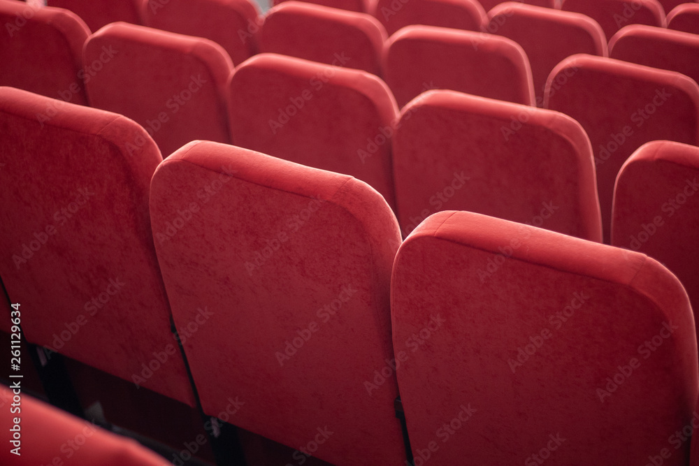 Fototapeta premium red armchairs close up. chairs at conference hall. pattern background.