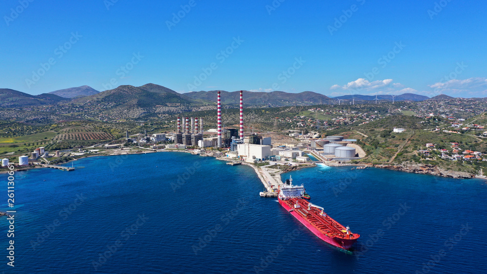 Aerial drone photo of industrial power plant by the sea in mediterranean destination