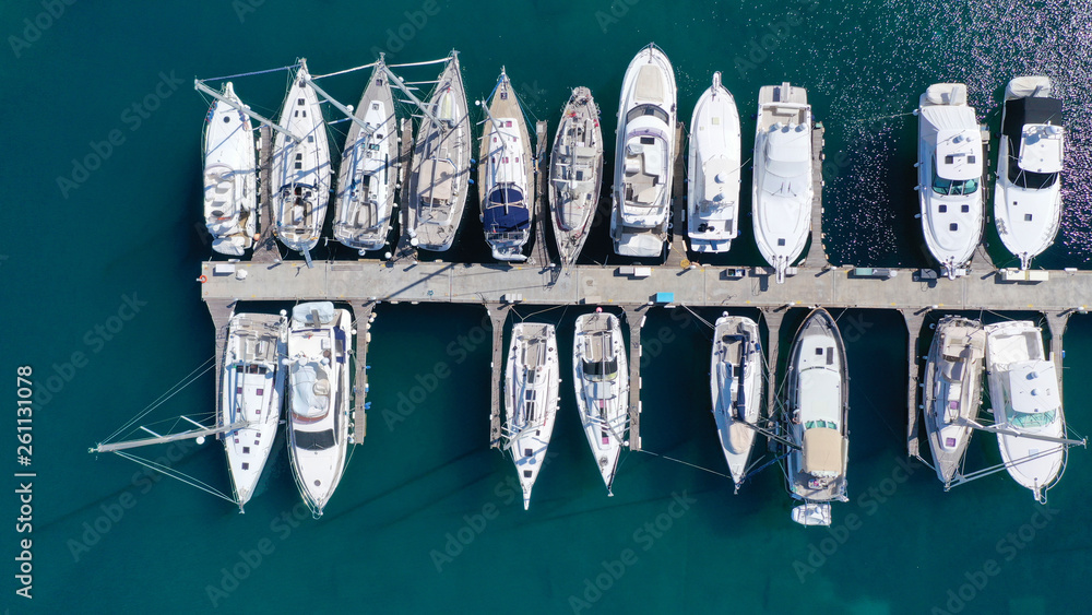 Aerial drone top view photo of mediterranean port with sail boats docked Aerial drone top view photo of mediterranean port with sail boats docked