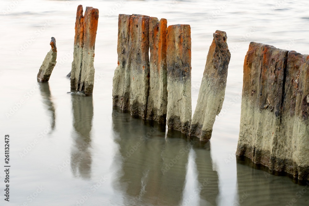 Details of rusty wooden planks and sea water Details of rusty wooden planks and sea water