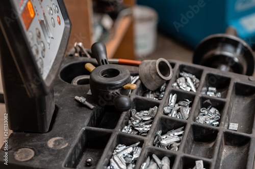 Car service. The tool for repair - Lead small weights and pincers for Wheel Balancing.