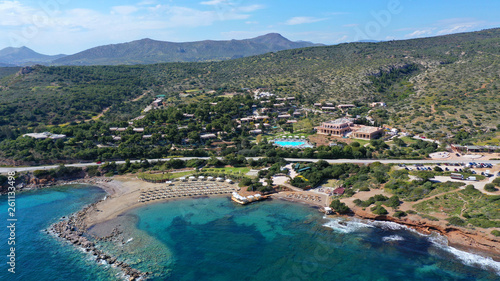 Aerial drone bird's eye view of resort near archaeological site of Cape Sounio with clear turquoise water beach, Attica, Greece © aerial-drone