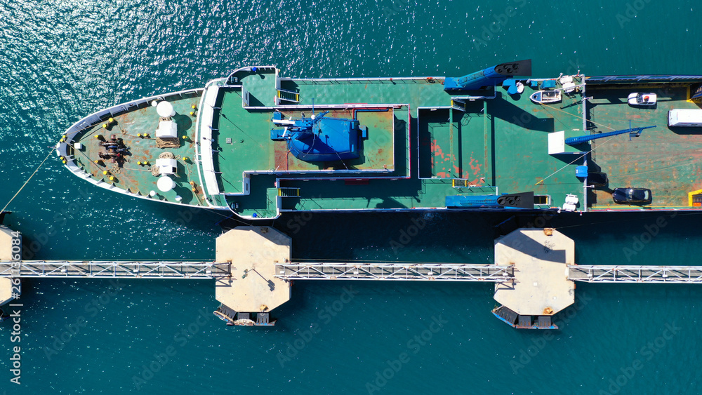Aerial top view photo of passenger ship docked in mediterranean port