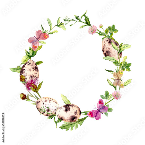 Easter wreath with eggs in grass, flowers. Round frame. Watercolor