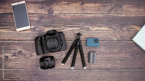 Travel kit coming on wooden table - Stop motion 