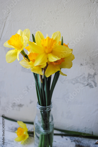 Bouquet of daffodils in a glass jar