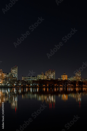 illuminated buildings with reflection on water at night © LIGHTFIELD STUDIOS