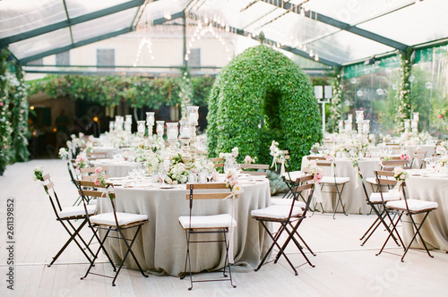 An elegant Italian wedding Reception in a clear marquee