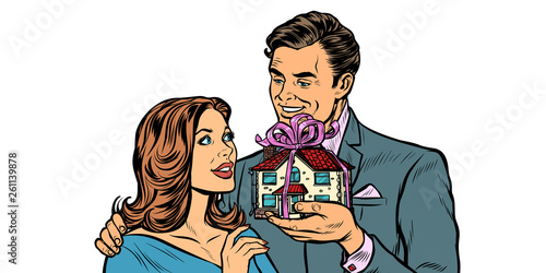 Husband and wife. House as a gift isolate on white background