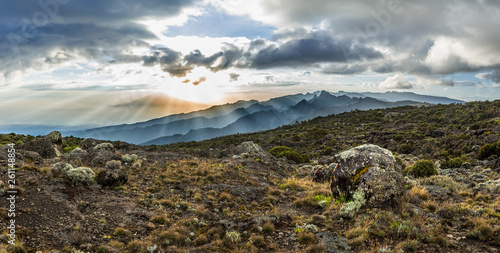 Photography Panoramic view of sunset over Mount Meru in Tanzania taken from the Shira Cave camp on the Machame route of Kilimanjaro