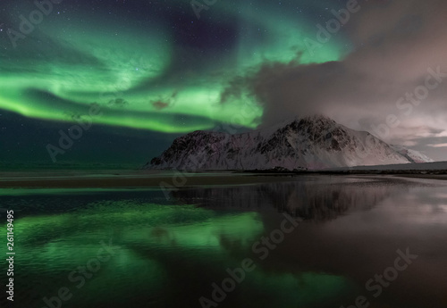 Aurora Borealis including her reflection on the beautiful beach of Skagsanden. Skagsanden beach is a beautiful location to take photo's.