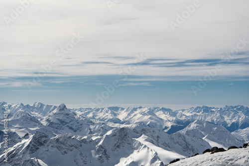mountains in snow, blue sky, Sunny weather, white snow lying on the mountains © John