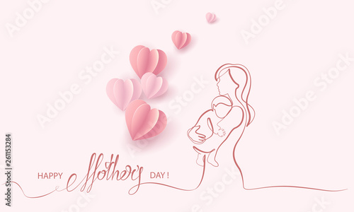 Woman hold her baby with air balloons
