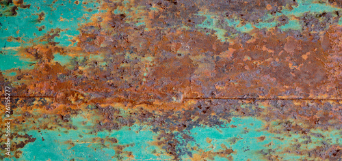 Rusty metal textured background. Old rough rusted grungy surface with chipped blue paint.
