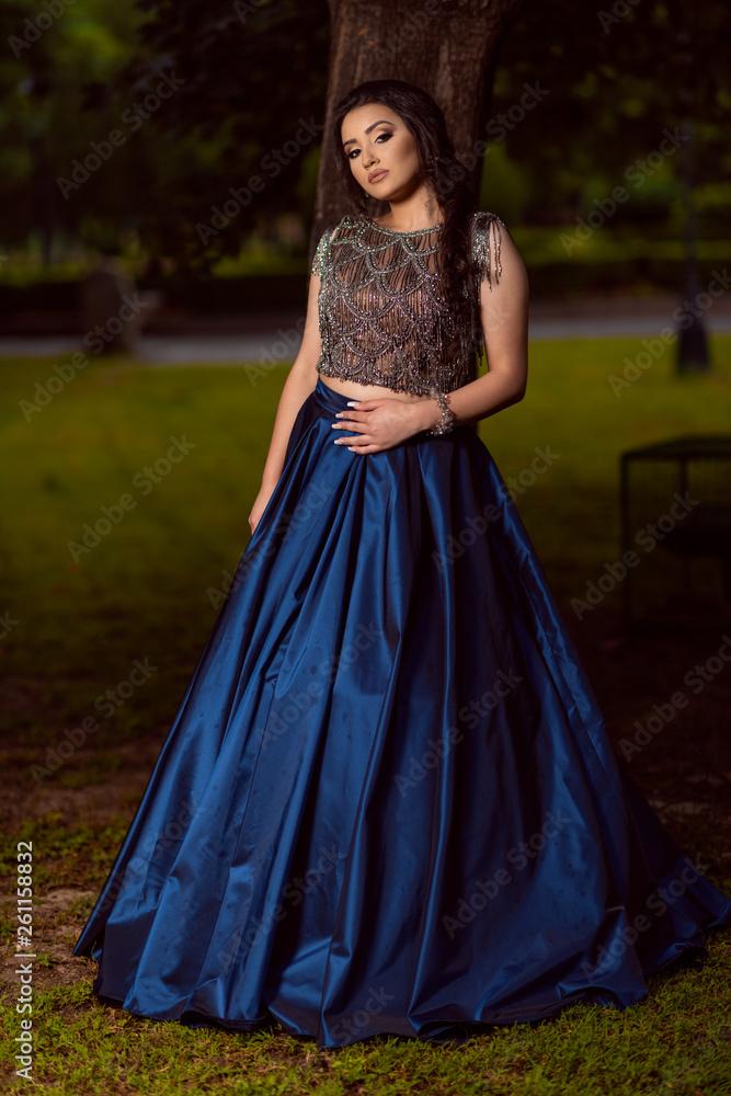Beautiful young lady in luxury blue dress for her prom night Beautiful young lady in luxury blue dress for her prom night