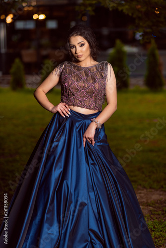 Beautiful young lady in luxury blue dress for her prom night © Kostadin