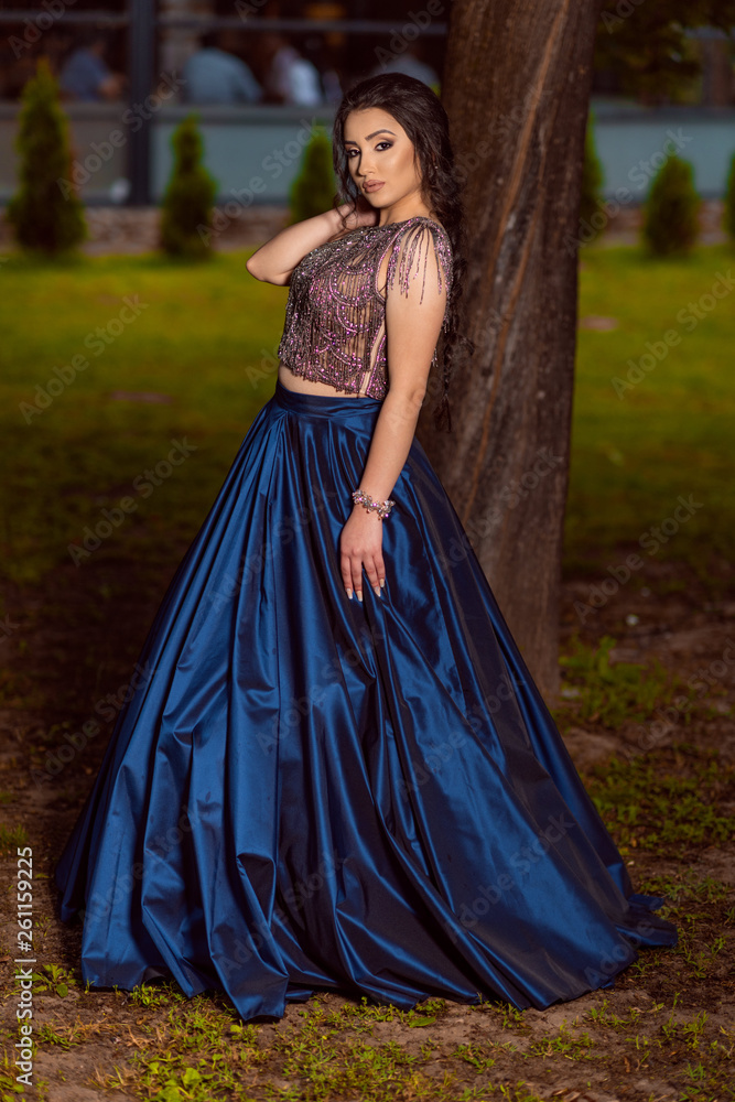 Beautiful young lady in luxury blue dress for her prom night Beautiful young lady in luxury blue dress for her prom night