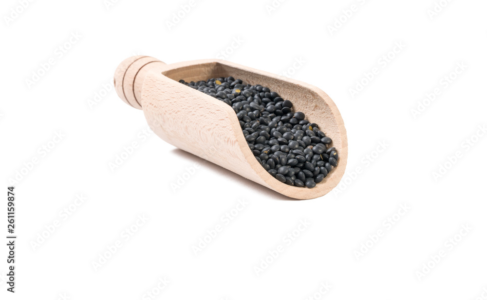 black lentils beluga in wooden scoop isolated on white background. nutrition. bio. natural food ingredient.front view. black lentils beluga in wooden scoop isolated on white background. nutrition. bio. natural food ingredient.front view.