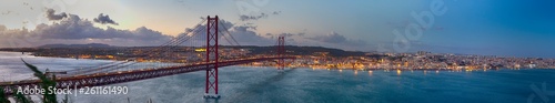 Crossing The Tagus River. Amazing Panoramic Image of Lisbon Cityscape Along with 25th April Bridge (Ponte 25 de Abril). Taken from Almada District