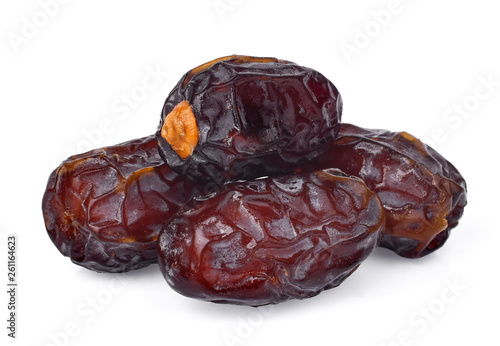 pile of dried medjool date fruit isolated on white background