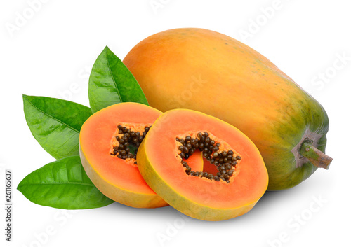 whole and slices ripe papaya fruit with green leaves isolated on white background