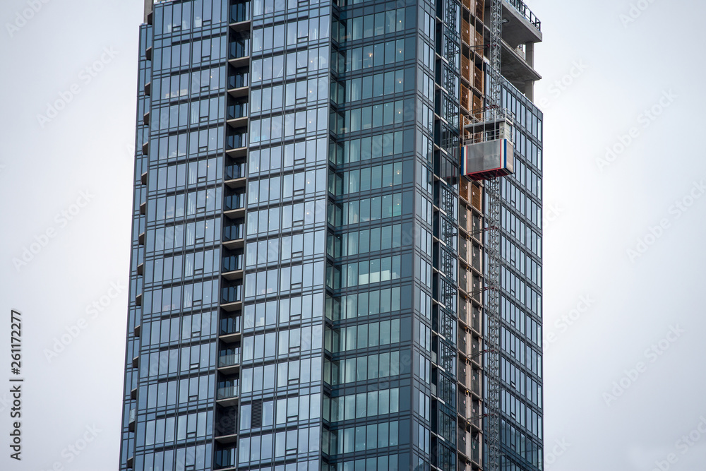 Elevator on a skyscraper construction site in downtown Montreal, Quebec. The lifts are used to finish the building process. Montreal is the second financial and business hub of Canada Elevator on a skyscraper construction site in downtown Montreal, Quebec. The lifts are used to finish the building process. Montreal is the second financial and business hub of Canada