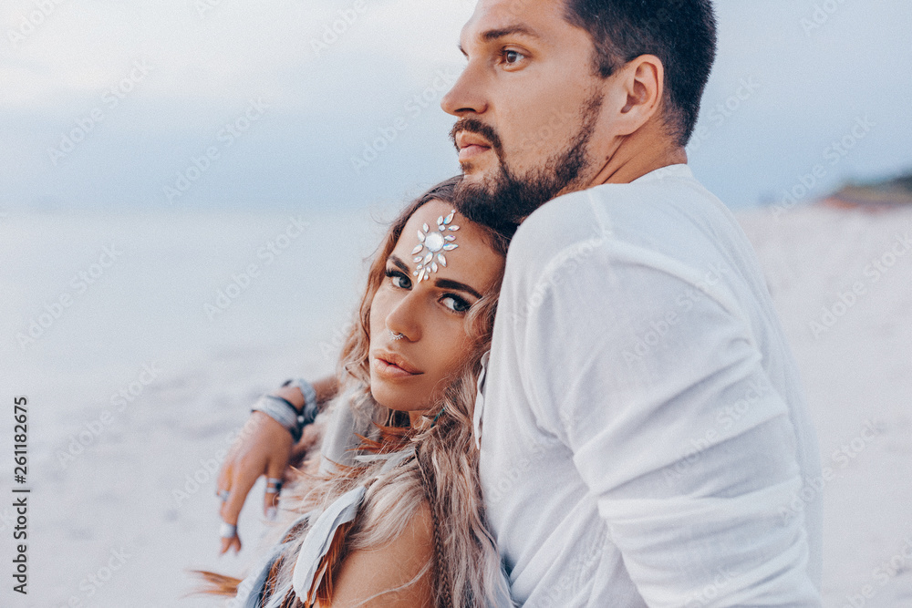 beautiful young couple on the beach at sunset. love and relationships concept beautiful young couple on the beach at sunset. love and relationships concept