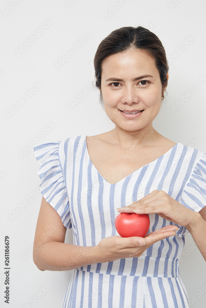 Woman holding red heart shaped Woman holding red heart shaped