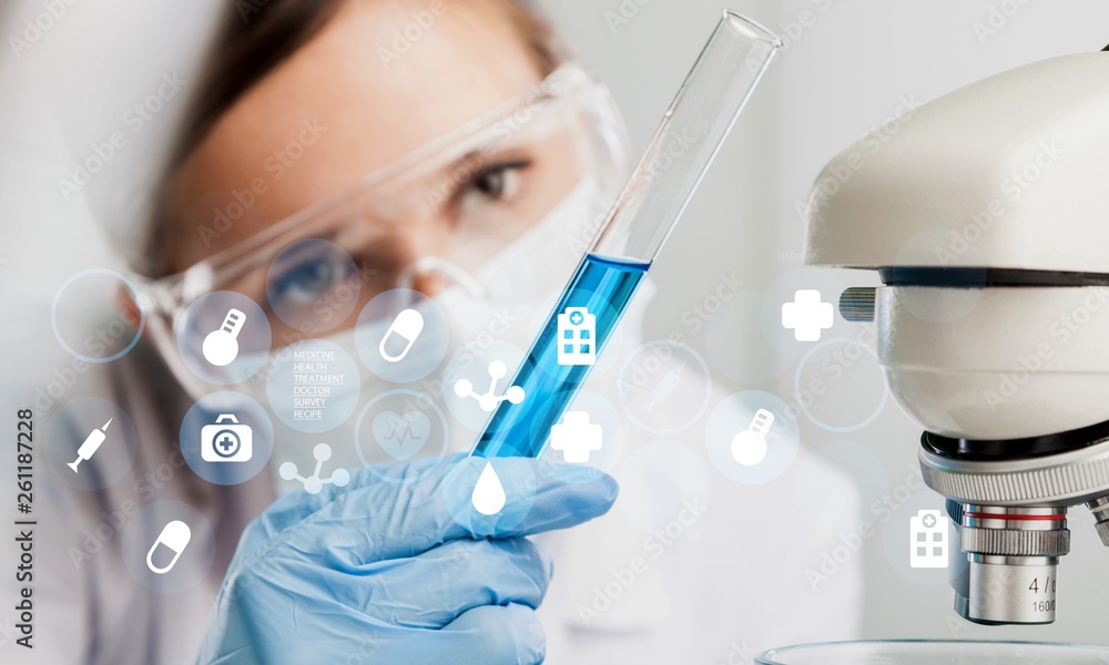 Young Female Scientist Working with Microscope Young Female Scientist Working with Microscope