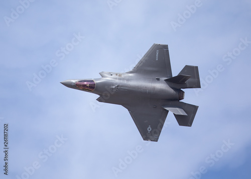 Very close top view of an F-35 Lightning II against the cloudy sky