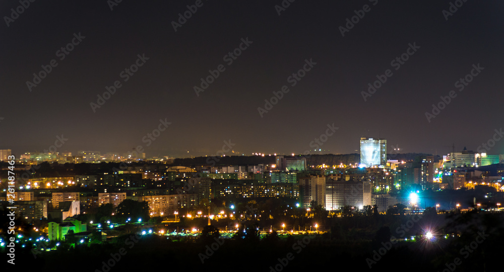 night panorama of the city with a high-rise building