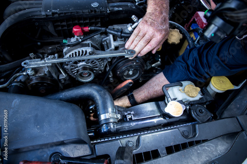 Close Up Photo Of Mechanic Repairing Car