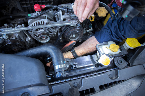 Close Up Photo Of Mechanic Repairing Car