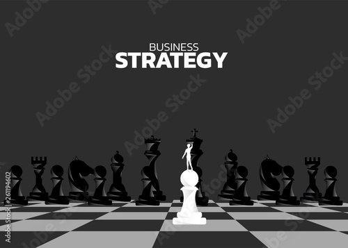 Silhouette of businessman on pawn standing in front of chess piece. concept of business strategy marketing.