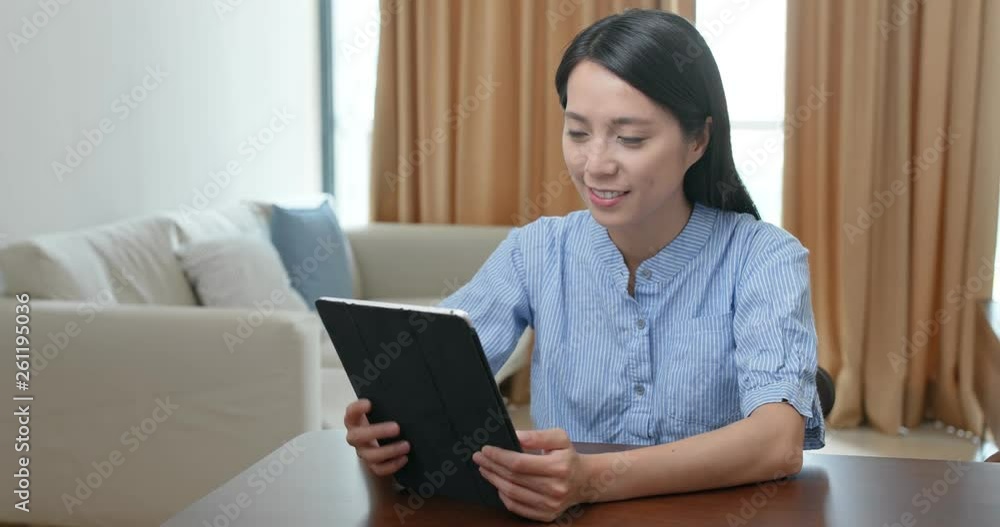 Woman use of tablet computer at home Woman use of tablet computer at home