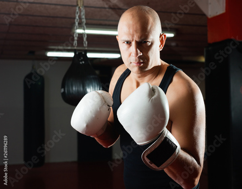 Potrait of man boxer who is training in gym © JackF