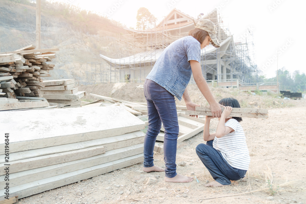 Children working at construction site for world day against children labour concept: