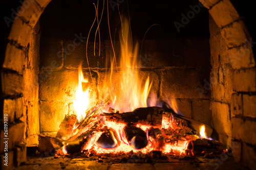 Wood burning in a cozy fireplace at home  keep warm