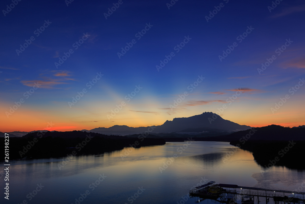 Amazing Beautiful Twilight Sunrise with Rays of light and Mount Kinabalu as background at Gayang, Tuaran, Sabah, Borneo