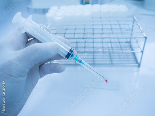 Wall Mural Close up doctor hand holding syringe during smear fine needle aspiration (FNA) from specimen breast
