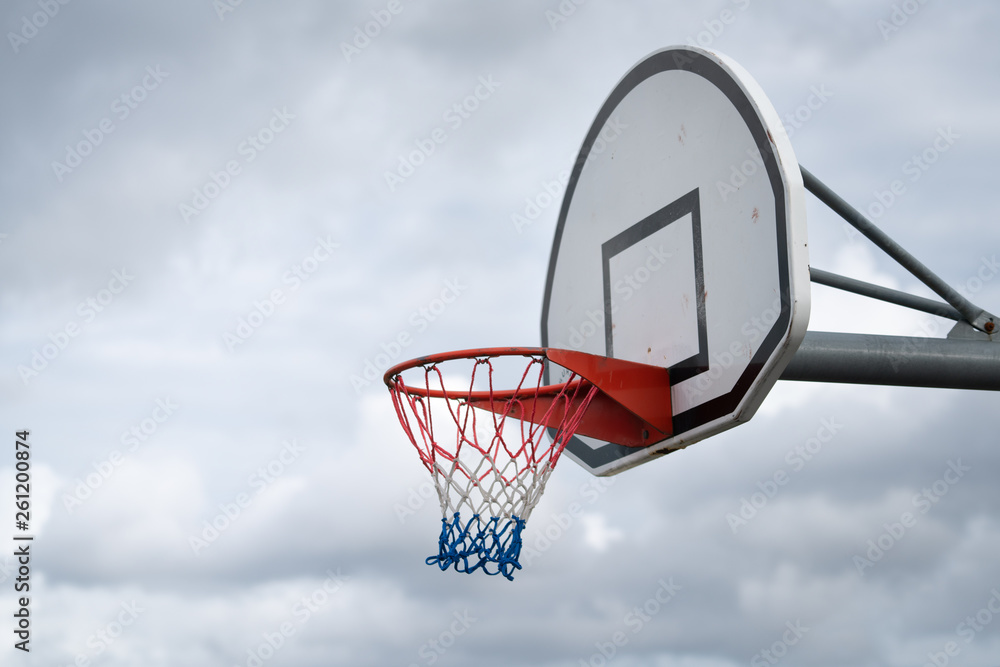 Basketball backboard against cloudy sky