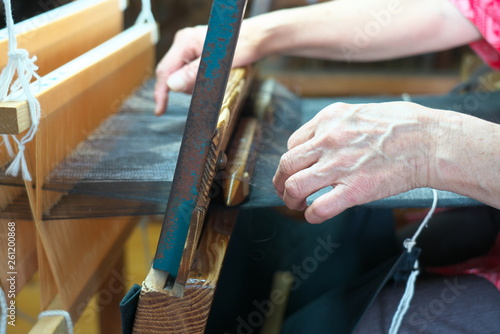 Amami Oshima, Japan - April 6, 2019: Weaving Oshima Tsumugi made of silk thread. Traditional pongee in Amami Oshima. 