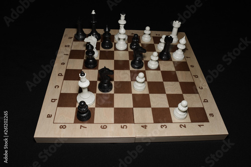 Chechered board with white pawns as a strategy theme