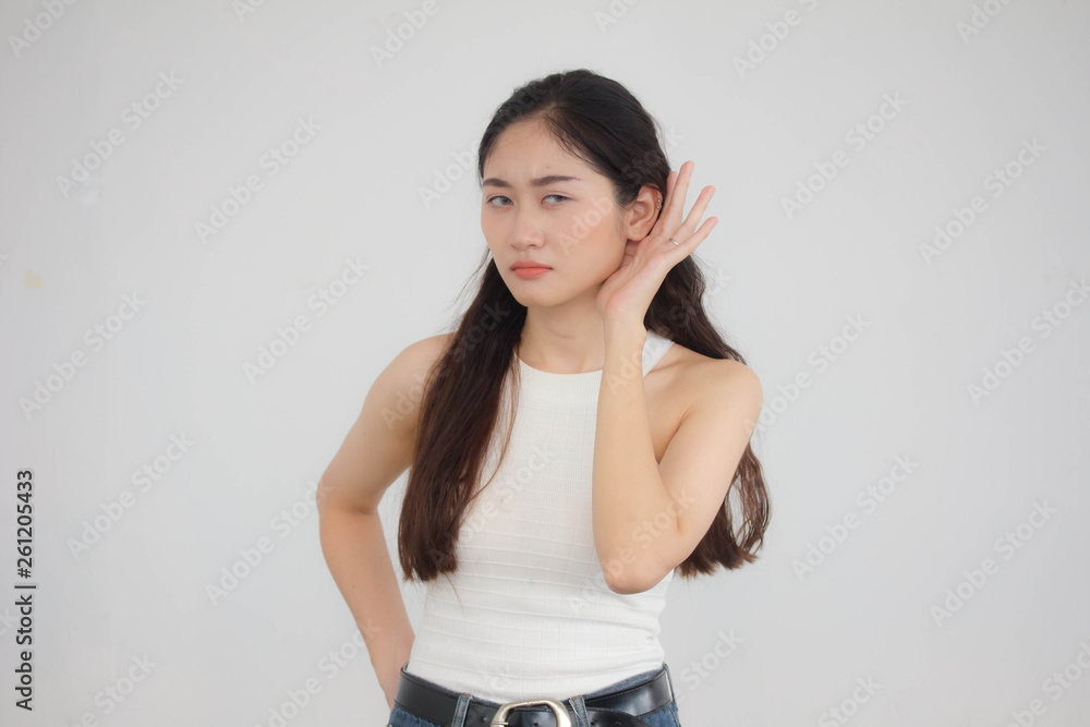 Portrait of thai china adult beautiful girl White shirt blue jeans listen Portrait of thai china adult beautiful girl White shirt blue jeans listen