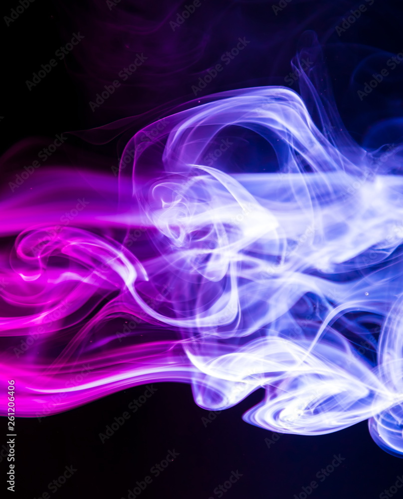 Fototapeta premium Colored smoke on black background