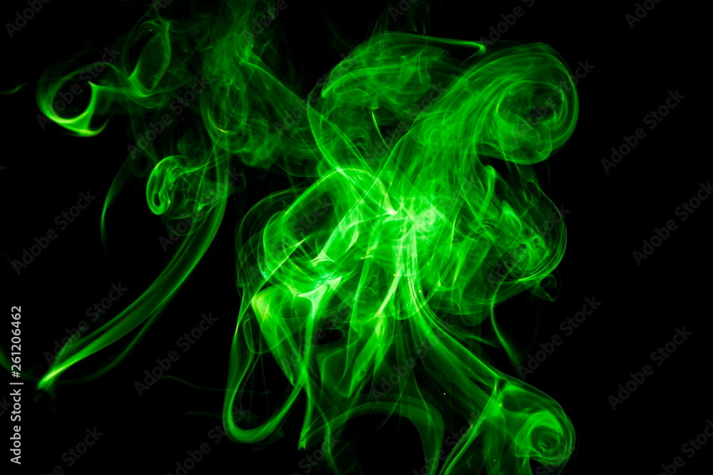 Green smoke on black background Green smoke on black background