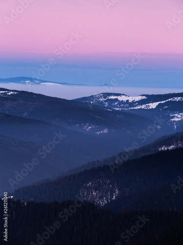 Colorful winter sunset in the Carpathian mountains.Romania,Hasmas National Park.