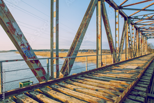 Old iron bridge. Broken construction and nature view, river. Travel photo 2019.