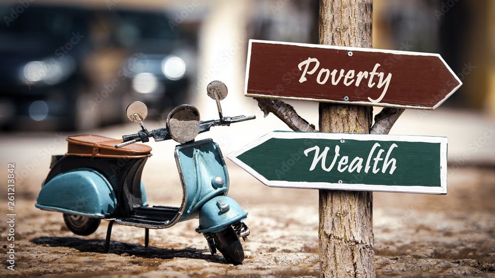 Street Sign Wealthy versus Overty Street Sign Wealthy versus Overty