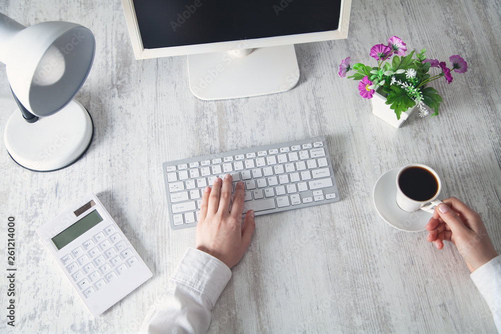 Business girl typing on a computer keyboard. Business concept Business girl typing on a computer keyboard. Business concept